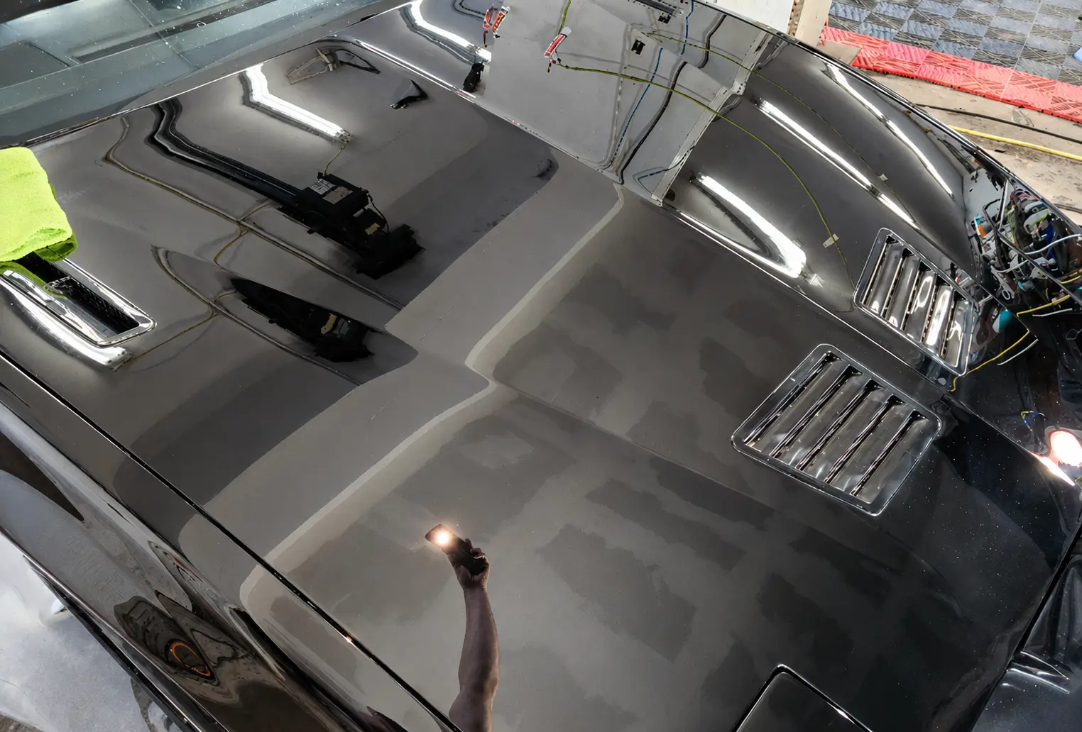 Vehicle hood after paint correction by Pristine Clean