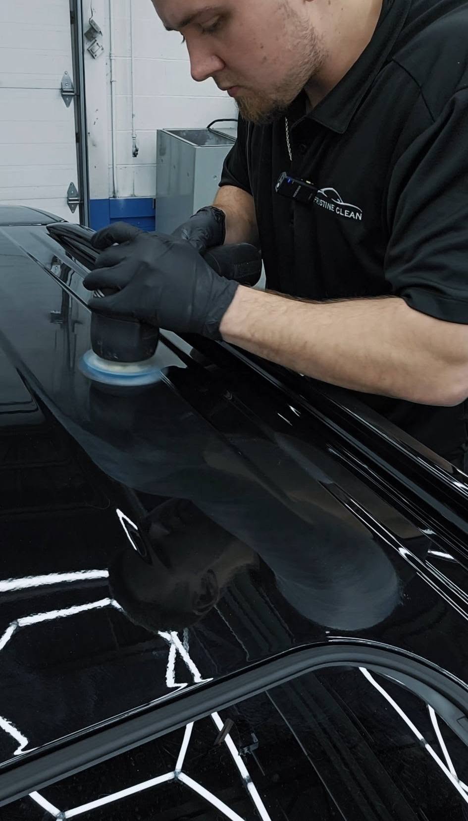 Gerard preparing vehicle paint inside Pristine Clean's Delmont studio