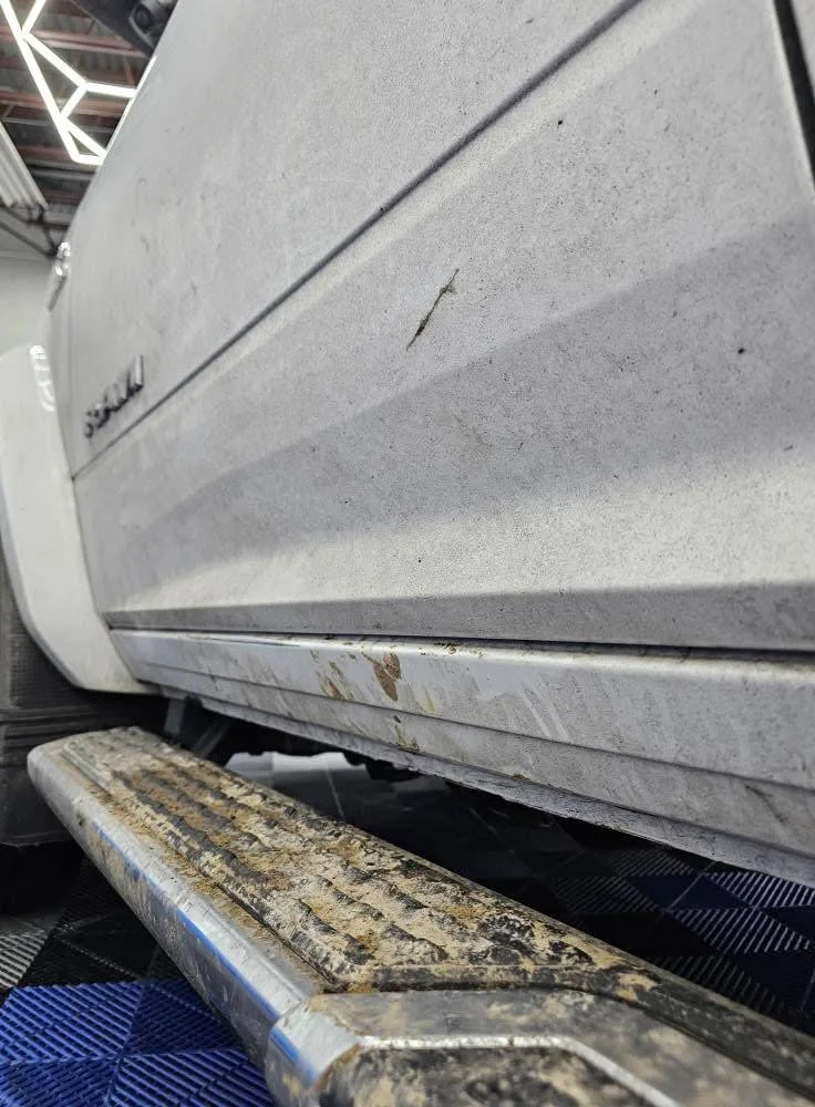 Heavy winter salt and slush buildup on lower rocker and side step