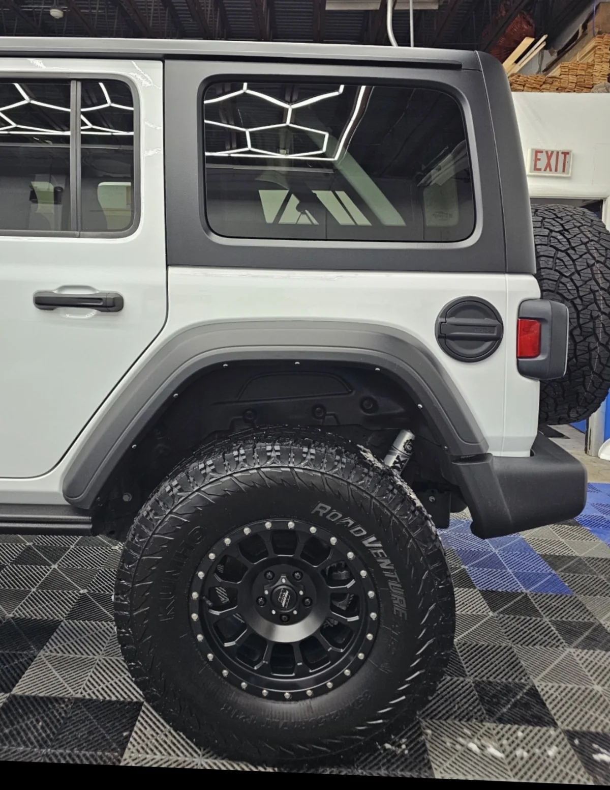Jeep wheel well and rear quarter after winter cleanup